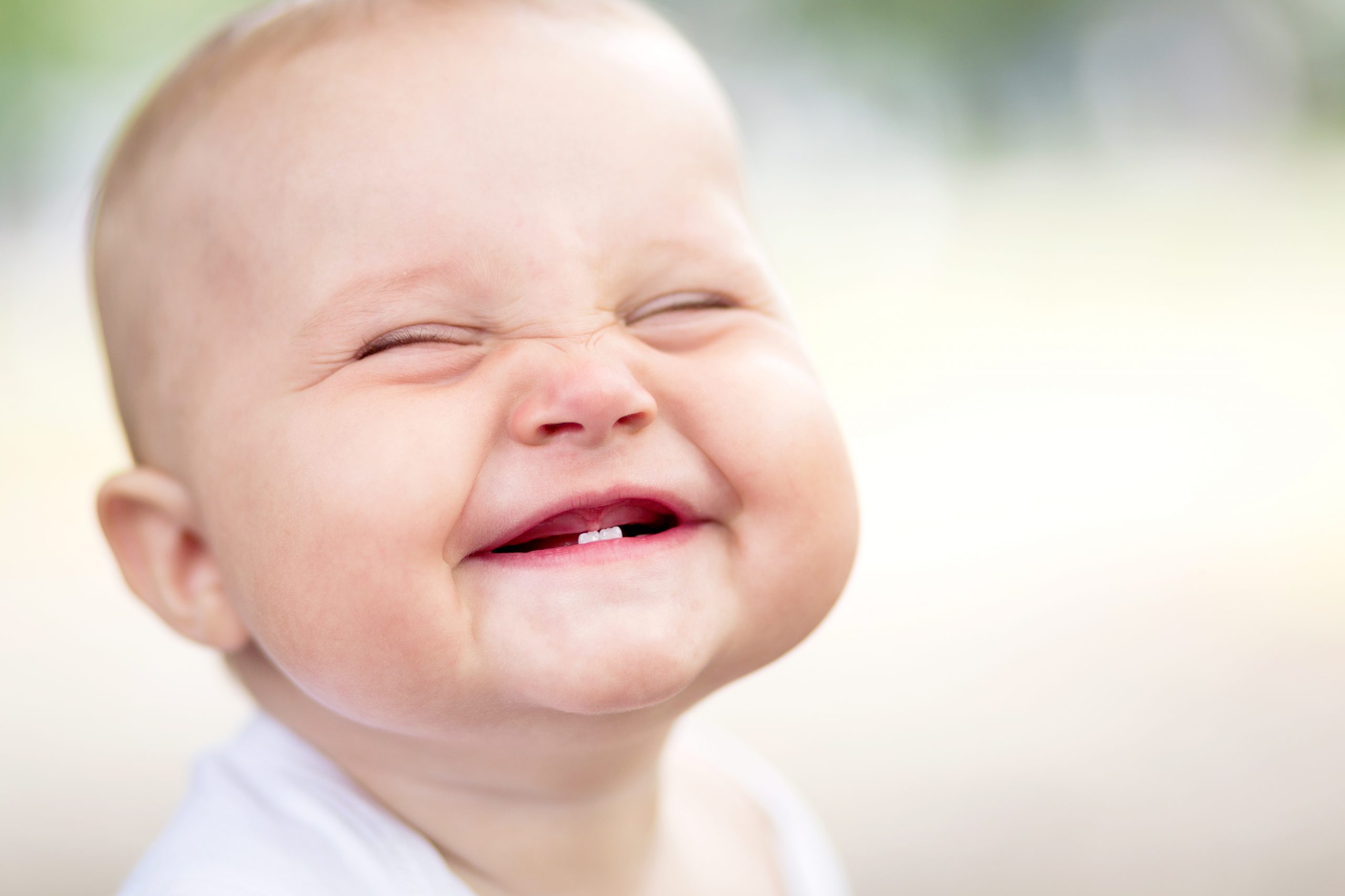 Grinning Baby with Two Teeth