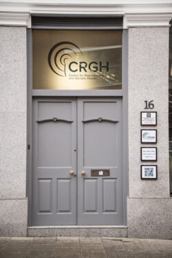 CRGH's grey office door, number 16, with the CRGH logo on the window pane above entrance.